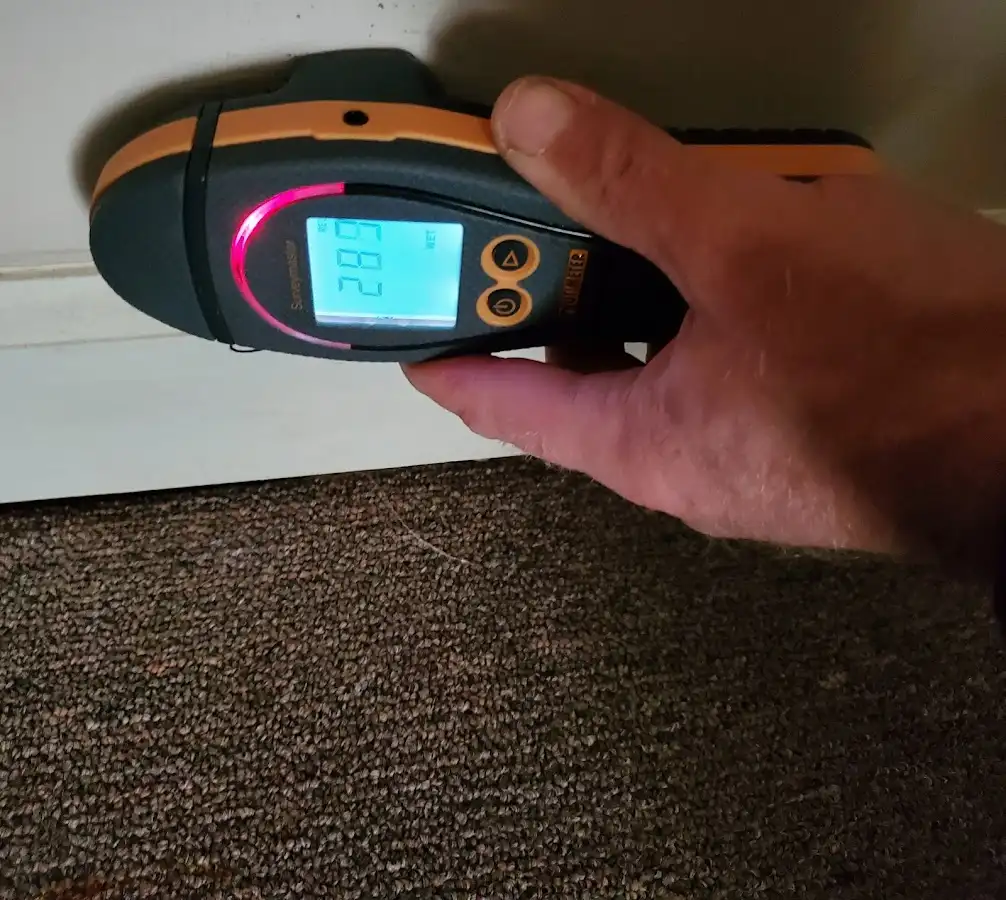 Moisture detection at baseboard during Storm Damage Restoration in St. Pete Beach